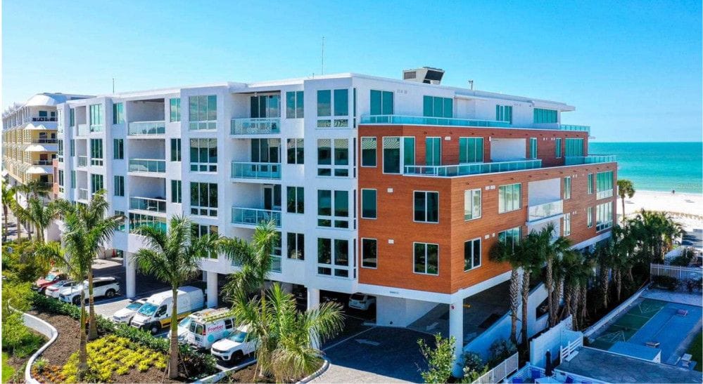 Beachfront condo featuring Sto stucco finish for a seamless and durable aesthetic design.