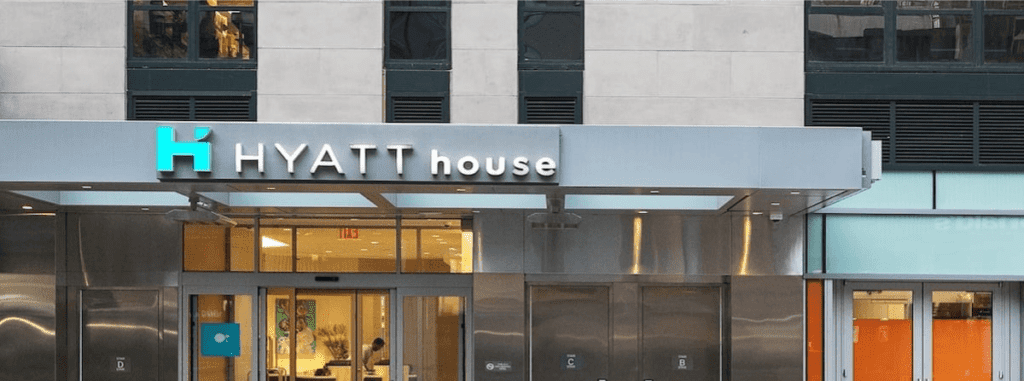 Hyatt House building in NYC featuring a limestone aesthetic.